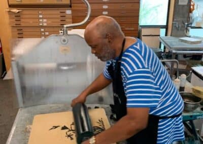 Joseph Norman inking up a litho stone with black ink
