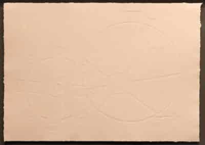 A blind embossing print on off-white paper. Various shapes such as circles, triangles, and spokes of a wheel are visible.