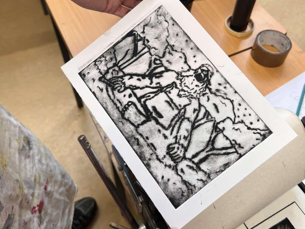 Close up of a black and white drypoint etching